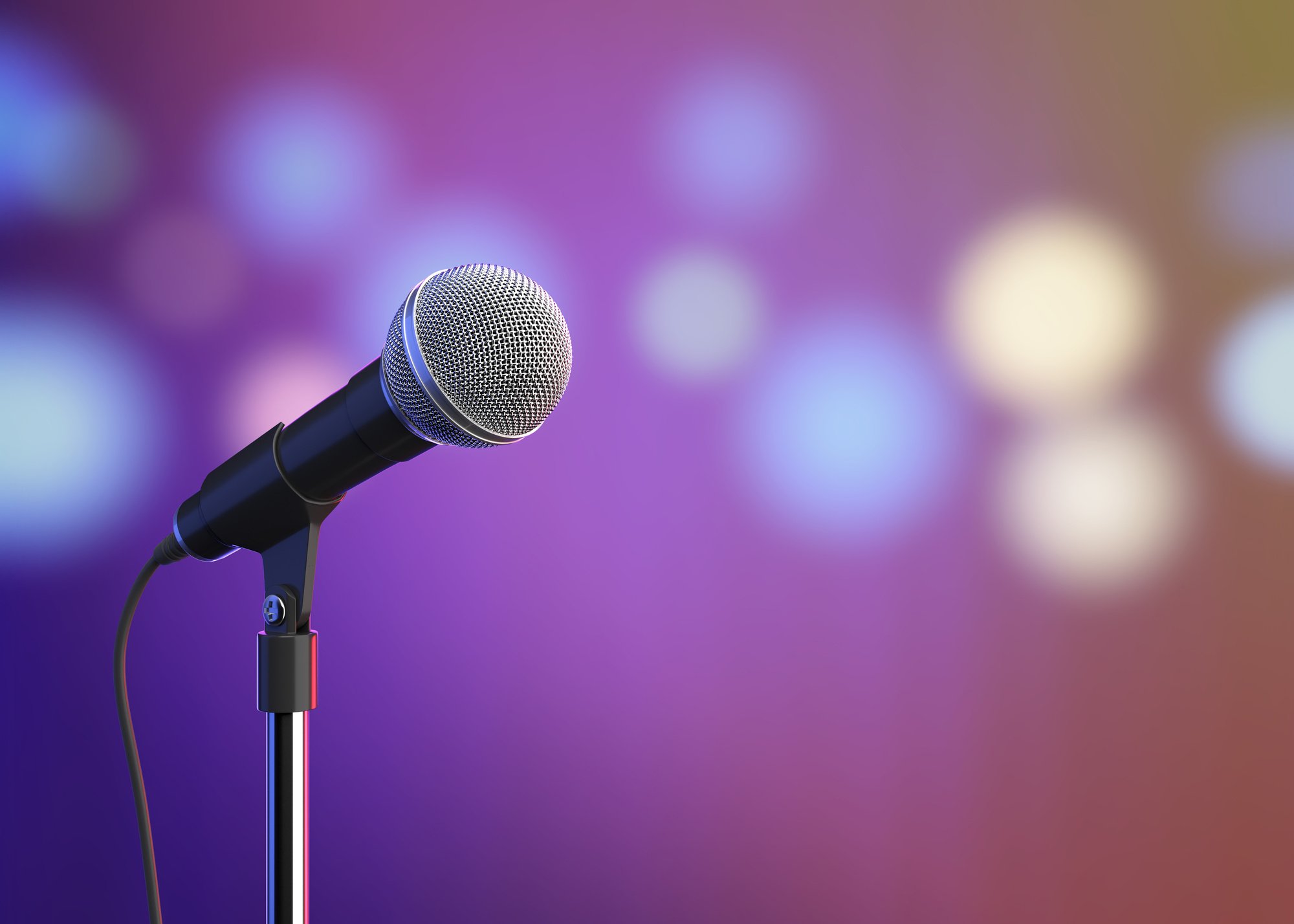 Microphone on stage with blurred lights